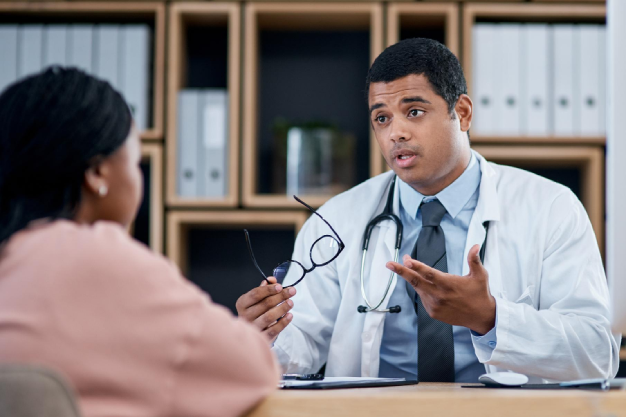 doctor-talking-patient-medical-consultation-checkup-visit-clinic-hospital-healthcare-center-professional-gp-frontline-worker-explaining-symptoms-while-asking-woman-questions