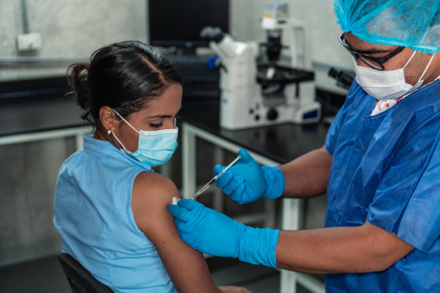 hispanic-woman-receiving-coronavirus-vaccine